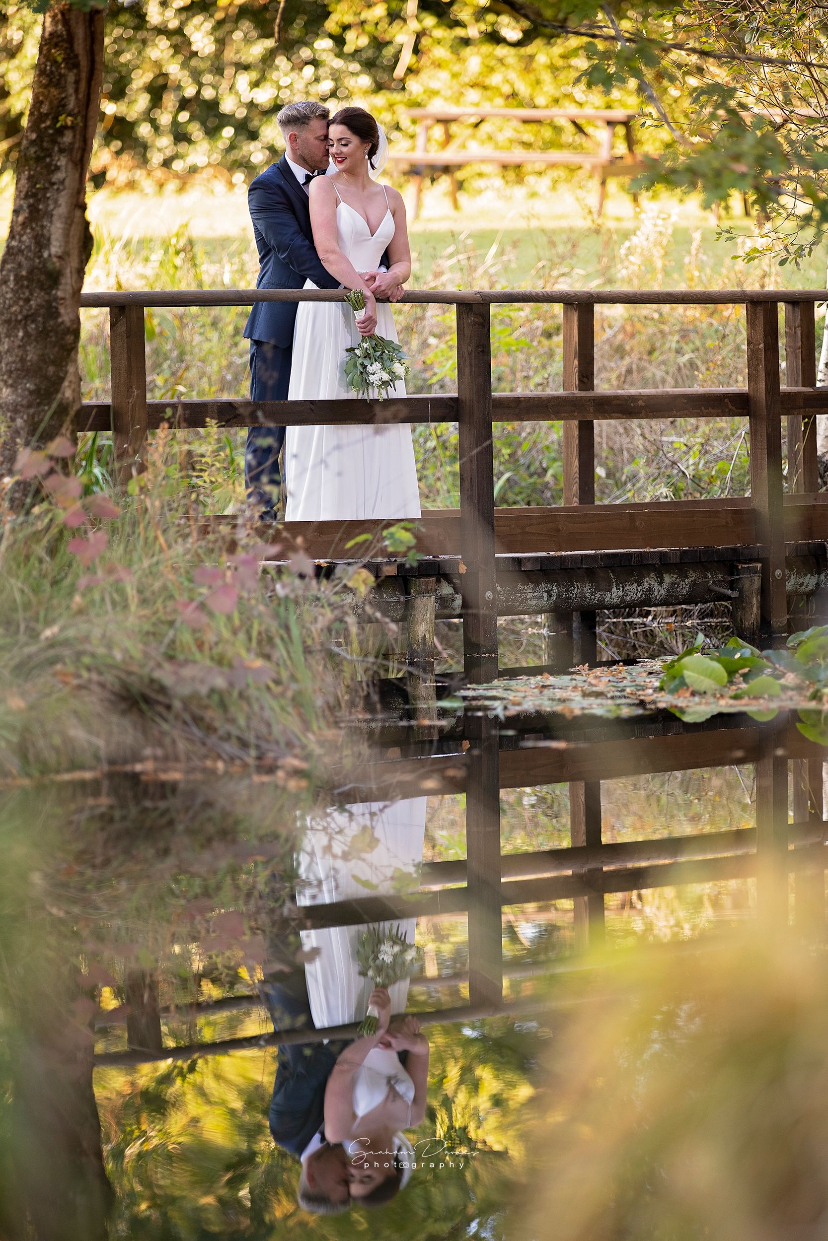 On The Bridge, a wedding photograph by Graham Davies at Llanerch Vineyard
